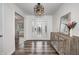 Light and airy entryway with console table, wood-look floors and glass door at 5909 Buttonwood Dr, Noblesville, IN 46062