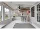 Screened porch features a tiki bar, string lights and ceiling fans at 5909 Buttonwood Dr, Noblesville, IN 46062
