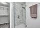 Large walk-in shower with marble tile and glass enclosure at 5909 Buttonwood Dr, Noblesville, IN 46062