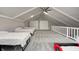 Spacious upstairs bedroom with three twin beds and a ceiling fan at 5909 Buttonwood Dr, Noblesville, IN 46062
