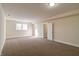 Spacious finished basement with neutral carpeting and window at 7290 Lockford Walk N, Avon, IN 46123