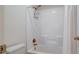 Clean bathroom with a shower/tub combo and white tile at 7290 Lockford Walk N, Avon, IN 46123