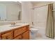 Clean bathroom with a tub shower, vanity, and tile floor at 7290 Lockford Walk N, Avon, IN 46123