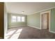 Bright bedroom with carpeted floor and neutral walls at 7290 Lockford Walk N, Avon, IN 46123