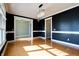 Spacious dining room with hardwood floors, dark walls, and a chandelier at 7290 Lockford Walk N, Avon, IN 46123