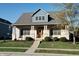 Beautiful two-story home with brick and siding, a covered porch and landscaping at 7290 Lockford Walk N, Avon, IN 46123