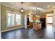 Open kitchen with island, granite countertops, and stainless steel appliances at 7290 Lockford Walk N, Avon, IN 46123