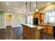 Modern kitchen with wood cabinets, granite countertops and a breakfast bar at 7290 Lockford Walk N, Avon, IN 46123