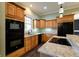 Eat-in kitchen with granite countertops, stainless steel appliances, and light wood cabinets at 7290 Lockford Walk N, Avon, IN 46123