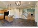 Open concept kitchen with island, granite countertops, and stainless steel appliances at 7290 Lockford Walk N, Avon, IN 46123