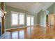 Living room with hardwood floors, fireplace, and view of backyard at 7290 Lockford Walk N, Avon, IN 46123