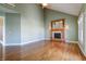 Living room with hardwood floors, fireplace, and access to back patio at 7290 Lockford Walk N, Avon, IN 46123