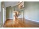 Bright living room with hardwood floors, vaulted ceilings, and access to deck at 7290 Lockford Walk N, Avon, IN 46123