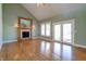 Spacious living room with hardwood floors, fireplace, and French doors at 7290 Lockford Walk N, Avon, IN 46123