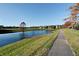 Peaceful community pond with a walking path nearby at 7290 Lockford Walk N, Avon, IN 46123
