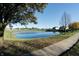 Serene community pond with a walking path alongside at 7290 Lockford Walk N, Avon, IN 46123