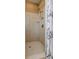 Large walk-in shower with tiled walls and a shower head at 7290 Lockford Walk N, Avon, IN 46123