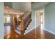 Elegant staircase with wrought iron railing and wood banister at 7290 Lockford Walk N, Avon, IN 46123