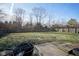 Spacious backyard with fire pit and wooden fence at 8391 Inland Dr, Avon, IN 46123