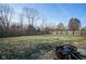 Spacious backyard with fire pit and wooden fence at 8391 Inland Dr, Avon, IN 46123