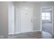 Inviting entryway with wood-look floors and views to living room at 8391 Inland Dr, Avon, IN 46123