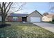 Brick and siding ranch home with attached garage and landscaped lawn at 8391 Inland Dr, Avon, IN 46123