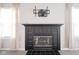 Black tiled fireplace with a TV mount above at 8391 Inland Dr, Avon, IN 46123