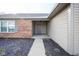 Gray front door entry with brick and siding exterior at 8391 Inland Dr, Avon, IN 46123