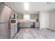Modern kitchen with gray cabinets and stainless steel appliances at 8391 Inland Dr, Avon, IN 46123