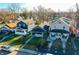 Three houses in a row, two grey and one light beige at 951 W 33Rd St, Indianapolis, IN 46208