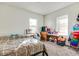 Charming bedroom with two windows, dresser, and double bed at 951 W 33Rd St, Indianapolis, IN 46208