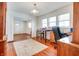 Dining room with hardwood floors, view into living room at 951 W 33Rd St, Indianapolis, IN 46208