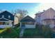 Grey house with white trim, steps, and small front yard at 951 W 33Rd St, Indianapolis, IN 46208