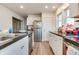 Kitchen with stainless steel appliances and white cabinets at 951 W 33Rd St, Indianapolis, IN 46208