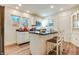 Bright eat-in kitchen with white cabinets, island, and new flooring at 951 W 33Rd St, Indianapolis, IN 46208