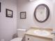 Small bathroom with an oval mirror and updated vanity at 1127 Grant Cir, Cicero, IN 46034