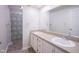 Double vanity bathroom with shower and tile floor at 1127 Grant Cir, Cicero, IN 46034