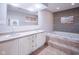 Double vanity bathroom with a soaking tub at 1127 Grant Cir, Cicero, IN 46034