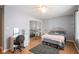 Bedroom with mirrored closet doors and wood floors at 1127 Grant Cir, Cicero, IN 46034