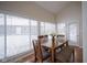 Dining area with wooden table and bench seating near sliding doors at 1127 Grant Cir, Cicero, IN 46034
