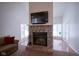Stone fireplace is a focal point in this living room, adding warmth and charm at 1127 Grant Cir, Cicero, IN 46034