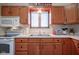 Kitchen sink and countertops with wood cabinets at 1127 Grant Cir, Cicero, IN 46034