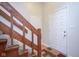 Wooden staircase with carpet runner and access to upper levels at 1127 Grant Cir, Cicero, IN 46034
