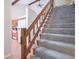 Indoor view of carpeted staircase with wooden railing at 1127 Grant Cir, Cicero, IN 46034