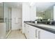Modern bathroom with double vanity and a large shower at 429 N Pennsylvania N St # 804, Indianapolis, IN 46204