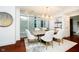 Bright dining room with a large table and modern light fixture at 429 N Pennsylvania N St # 804, Indianapolis, IN 46204