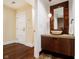 Modern powder room with a vessel sink and dark wood vanity at 429 N Pennsylvania N St # 804, Indianapolis, IN 46204