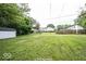 Large backyard with grassy area and detached shed at 1519 E Mills Ave, Indianapolis, IN 46227