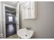 Small bathroom with a sink and view of bedroom at 1519 E Mills Ave, Indianapolis, IN 46227