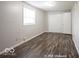 Simple bedroom with dark gray wood-look vinyl floor at 1519 E Mills Ave, Indianapolis, IN 46227